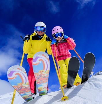 Children on skis in the snow