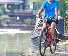Cycling along the canal towpath in an urban setting